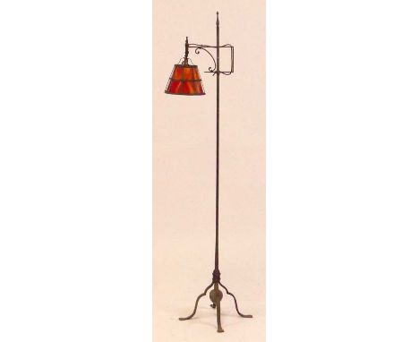 Samuel Yellin (1884-1940) - a wrought iron lamp stand, circa 1930s, raised on slightly hipped supports to flattened feet, the