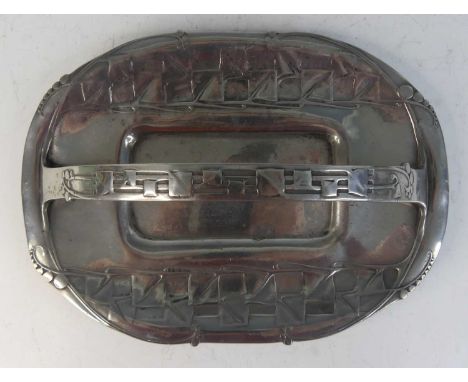 Archibald Knox (1864-1933) for Liberty &amp; Co - a Tudric pewter single handled cake basket, with stylised floral raised and
