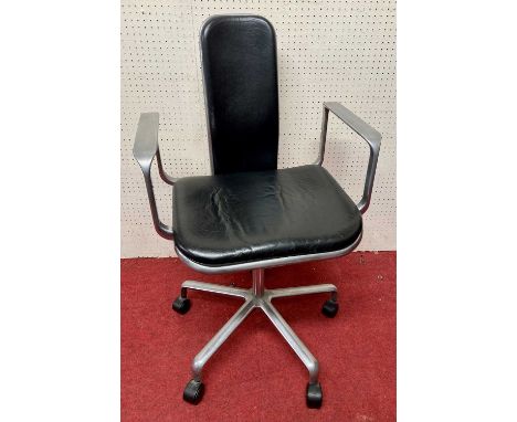 A 1960s brushed aluminium swivel elbow desk chair, having black leather pad back and tilting seat, flattened arm rests, raise