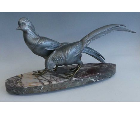 A large French Art Deco silvered spelter model of two pheasants, by Guislain, each modelled in standing pose, one with head u
