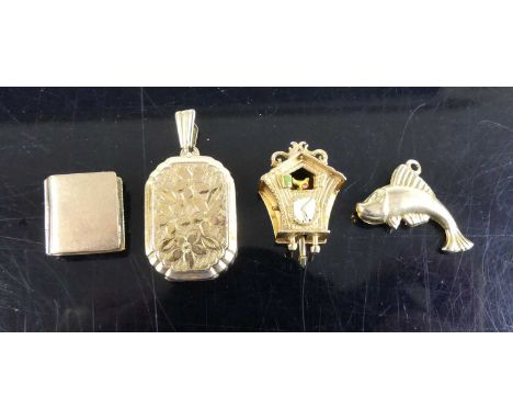 A collection of four Georg Jensen (1866-1935) 9ct gold charms, to include hinged locket, novelty notebook, cuckoo clock and a
