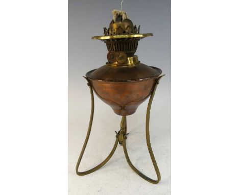 W.A.S. Benson - a copper and brass oil lamp, with integral inset reservoir, stamped marks to underside of one support, h.34cm