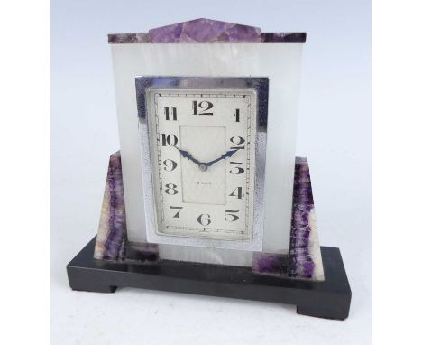 An Art Deco blue-john, pale agate and slate desk clock, having a rectangular stylised dial with chromed metal trim, eight-day