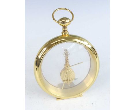 A Jaeger-LeCoultre 1970s gilt brass desk clock, in the form of an oversize pocket watch, with 16-jewelled movement, swing car