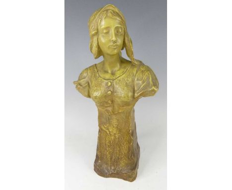 An Austrian Art Nouveau Goldscheider painted pottery female bust, looking to sinister and modelled with headscarf, on an elon