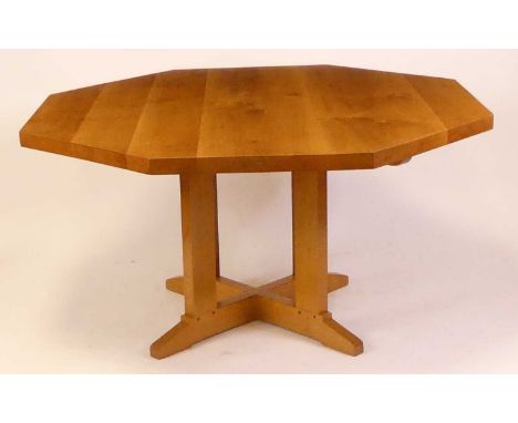 A good quality contemporary light oak octagonal centre table, of joined planked construction, raised on X-framed base, h.78cm