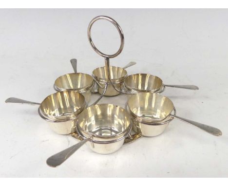 An early 20th century silver six place condiment set, housed on wired silver holder with loop handle, maker T. Wilkinson &amp