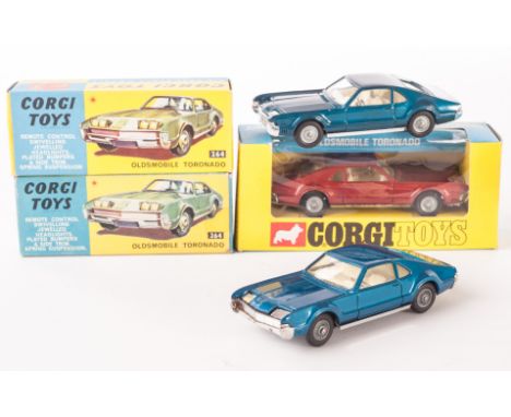 Corgi Toys 264/276 Oldsmobile Toronado, three examples, two 264 with dark blue body, detailed cast hubs, one 276 with metalli