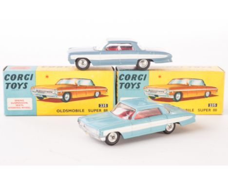 Corgi Toys 235 Oldsmobile Super 88, two examples, one light blue body, red interior, spun hubs, one steel blue body, red inte