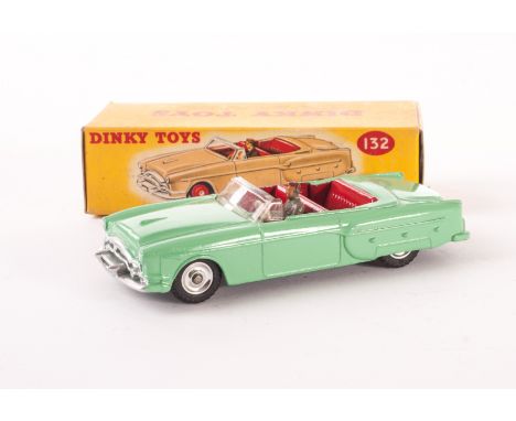 A Dinky Toys 132 Packard Convertible, light green body, red interior, grey driver, spun hubs, in original box with correct co