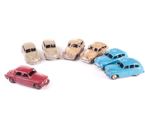 Dinky Toys 40e Standard Vanguard, four examples, two fawn body and hubs, open rear wheel arches, two mid blue, closed wheel a