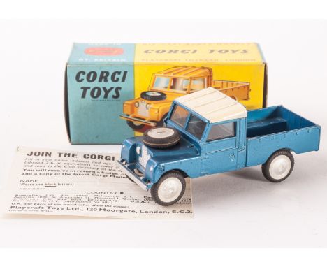 A Corgi Toys 406 Land Rover 109 LWB, metallic blue body, cream roof, flat spun hubs with wheel decals, leaflet, in original b