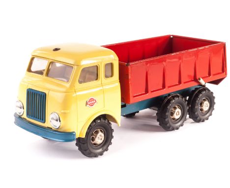 A Gama Clockwork Tipper Lorry, yellow plastic cab, tinplate interior, chassis and back, chrome hubs, rubber tyres, with key, 