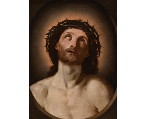 CIRCLE OF GUIDO RENI (ITALIAN 1575-1642) HEAD OF CHRIST CROWNED WITH THORNS Oil on canvas, feigned oval 66 x 49.5cm (25 x 19¼