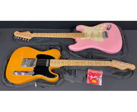 Musical Instruments - a Fender Telecaster type electric guitar, orange, soft case; a Nevada Stratocaster type electric guitar