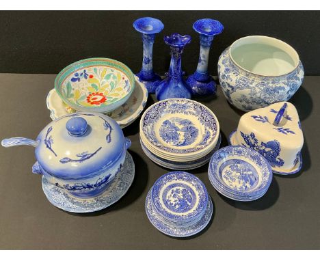 A pair of Staffordshire flow blue type candlesticks, 25cm high; others similar, including a soup tureen and cover, cheese dis