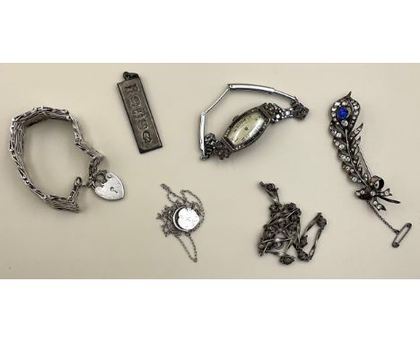 A selection of silver, base metal jewellery and an Art Deco wristwatch, the silver jewellery includes a commemorative Queen's