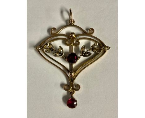 An Art Nouveau 9ct rose gold heart shaped pendant, applied with leafy vines inset with almandine garnets and seed pearls, scr