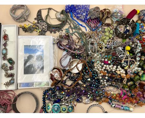 A collection of costume jewellery and postcards, to include glass, ceramic, base metal and plastic bead necklaces, bangles, p
