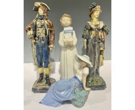 A pair of 19th century Majolica figures, 32cm high; two Nao figures, the largest 28cm high (4)
