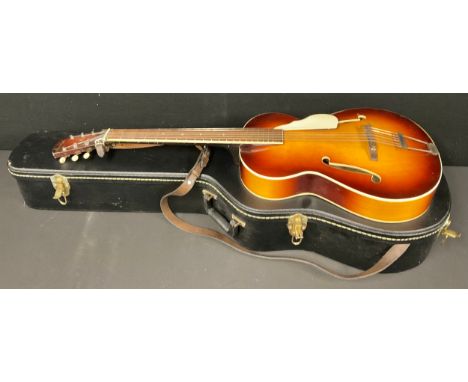 Musical Instruments - a 1950s Triumph arch-top acoustic guitar, ivorine tuning pegs, hard case