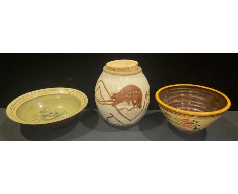 An Art Pottery ginger jar, depicting a nude figure, marked, 14.5cm high; two Art Pottery bowls, the largest with a 9.5cm diam