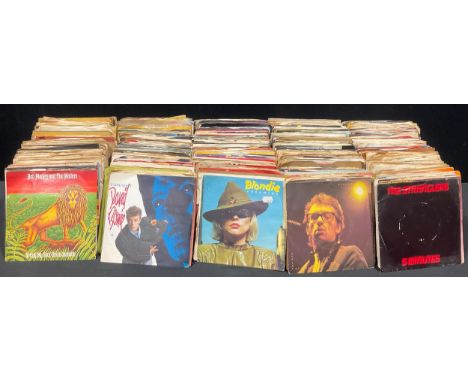 Vinyl Records - Two boxes of 7” singles, including: The Stranglers, Elvis Costello, Bob Marley and the Wailers, Blondie, Bone