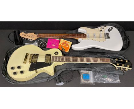 Musical Instruments - an unmarked Les Paul style electric guitar, soft case; an unmarked Stratocaster type electric guitar, w