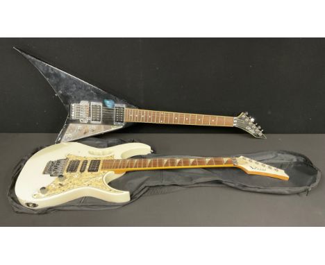 Musical Instruments - a Woody Steve Vai type electric guitar, with 'monkey handle', soft case; a Rally flying V electric guit