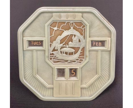 An Art Deco Bakelite perpetual easel calendar, the dial centred with a canted fretwork panel depicting a gondola with basilic