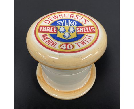 Advertising - a large novelty ceramic jar, as a cotton reel, the press close cover transfer printed with DEWHURST'S SYLKO lab
