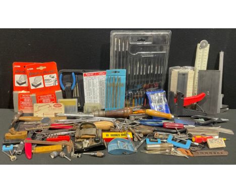 A model maker's tool kit, including miniature boxwood plane, 6cm long; miniature "Zip" plane and blades, 8cm long; set of thr