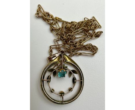An Art Nouveau 9ct rose gold blue paste stone pendant with 9ct gold fetter link chain,the pendant set with a lagoon blue roun