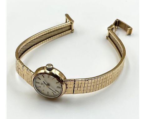 A lady's vintage 9ct gold omega wristwatch with 9ct gold strap, stamped "9 375", watch strap tapers from approx. 8mm-6mm wide
