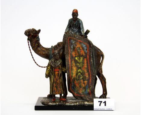 An Austrian cold painted soft metal Arab carpet seller strike lighter, H. 19cm.