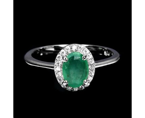 A 925 silver emerald and white stone set cluster ring, (M).