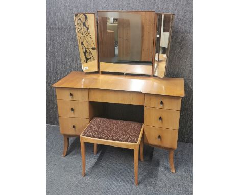 A 1960's light wood dressing table and stool by Frederick Restall Ltd, W. 116cm overall H. 139cm.