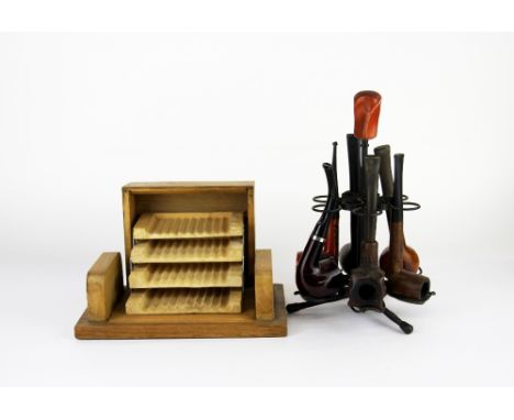 A smoker's pipe stand and cigarette box.