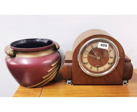 An Art Deco chiming mantle clock and a ceramic plant holder.