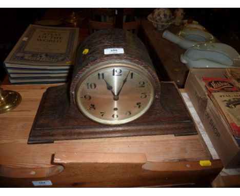 A 1930's oak cased three hole mantel clock 