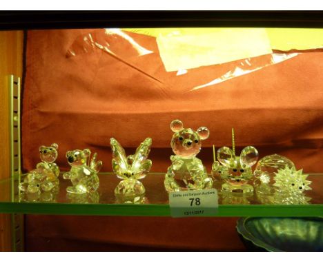 A collection of Swarovski crystal glass ornaments with boxes 