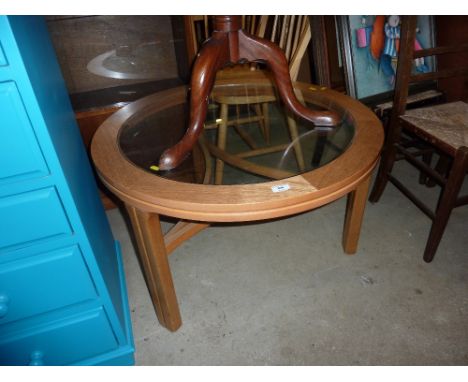 A light oak glass topped coffee table 