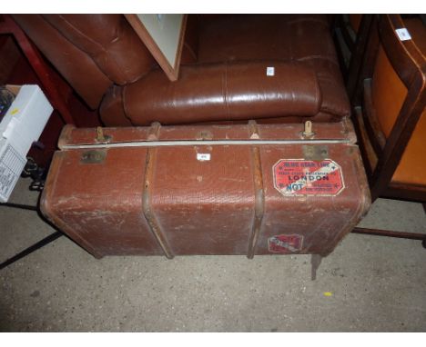 A wooden bound travelling trunk