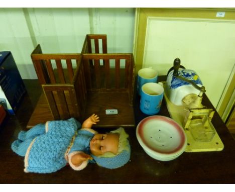 An oak revolving table top bookcase; a blue and white coffee grinder; two Saddler mugs; a dressed doll etc. 