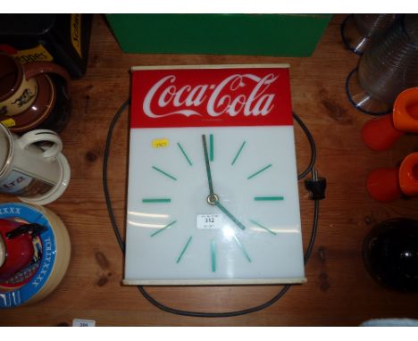 A vintage Coca-Cola wall clock 