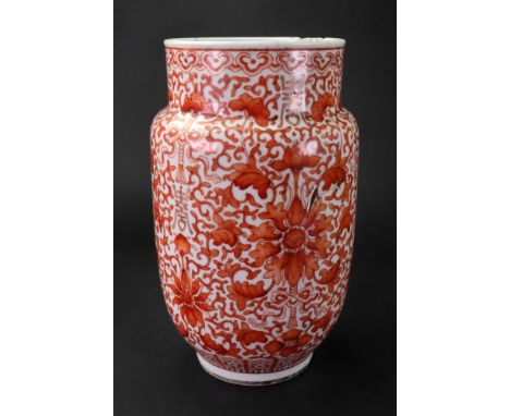 A Chinese porcelain vase, 19th century, of cylindrical form, painted in iron-red with lotus flowers, bats and shou characters