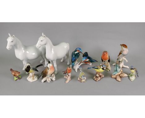 A collection of eleven Goebel, Royal Worcester, German and other model birds and a pair of Chinese white glazed figures of ho