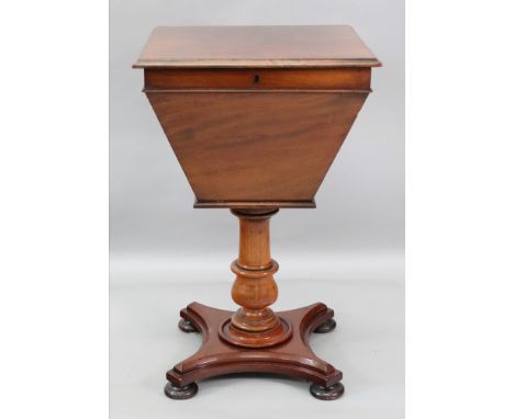 An early Victorian mahogany sarcophagus shape work table, the moulded hinged top enclosing a lined interior and lift-out fitt