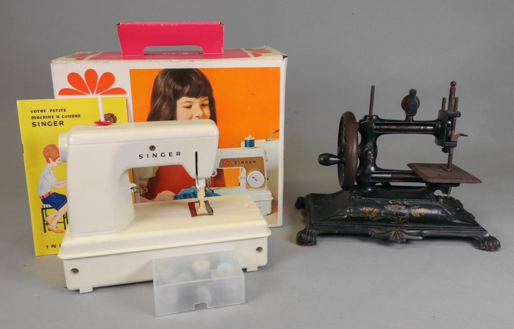 A child's battery operated Singer sewing machine, circa 1960's, boxed