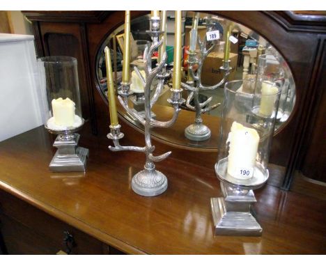 A pair of candlestick holders by culinary concept, London and an antler candelabra height 51cm